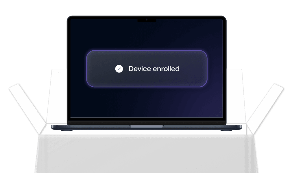 A Mac laptop screen showing a glowing “Device enrolled” confirmation banner, indicating successful macOS enrollment.