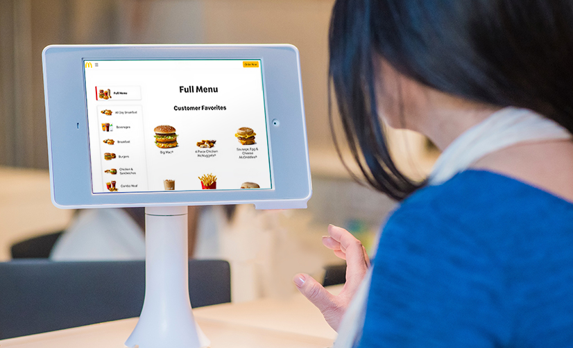 Using a self-service kiosk at Mc Donalds